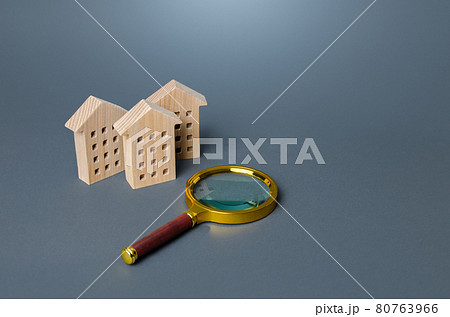 Residential buildings and magnifying glass. Housing search concept. Buying or renting apartments. Realtor service. Monitoring real estate market. Rent of commercial premises for offices. Best options 80763966