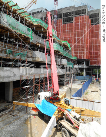 PERAK, MALAYSIA -SEPTEMBER 23, 2016: Concrete pumping machine able to pump concrete in large quantities at one time. It can save time and speed up concreting work. PERAK, MALAYSIA -SEPTEMBER 23, 2016: Concrete pumping machine able to pump concrete in large quantities at one time. It can save time and speed up concreting work. 80764743