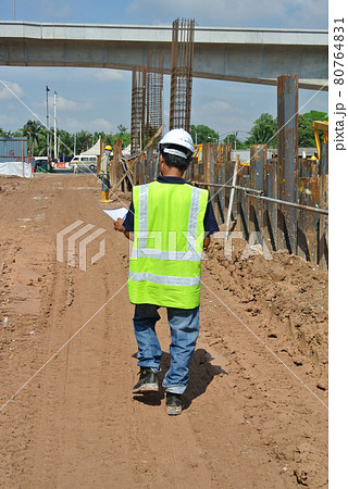 JOHOR, MALAYSIA -JUNE 17, 2016: Construction workers walking in the construction site.  80764831