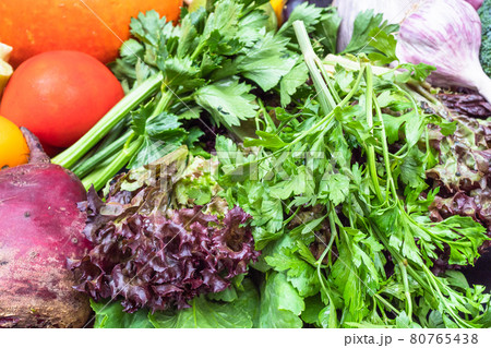 lettuce and fresh ripe vegetables on table lettuce and fresh ripe vegetables on table 80765438