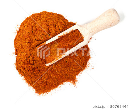 top view of scoop on cayenne pepper on white 80765444