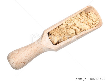 top view of ginger powder in wooden scoop cutout top view of ginger powder in wooden scoop cutout 80765459
