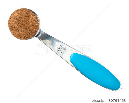 nutmeg powder in measuring teaspoon cutout nutmeg powder in measuring teaspoon cutout 80765463