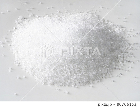 handful of fructose crystalline sugar on white handful of fructose crystalline sugar on white 80766153