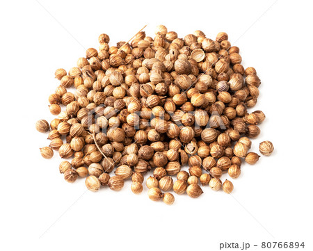 handful of dried coriander seeds closeup on white 80766894