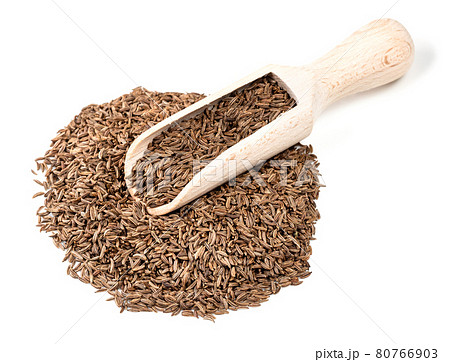 wooden scoop on pile of caraway fruits on white wooden scoop on pile of caraway fruits on white 80766903