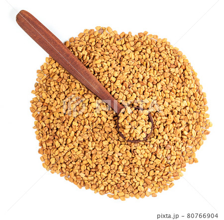 top view of wood spoon on Fenugreek seeds on white top view of wood spoon on Fenugreek seeds on white 80766904