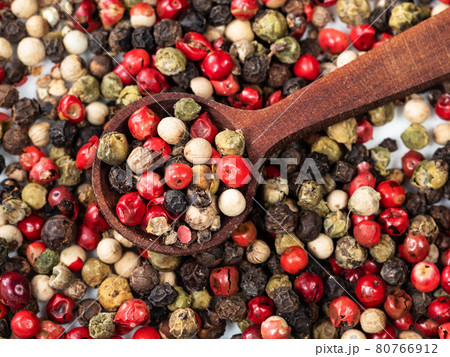 wooden spoon in Four Pepper Blend closeup wooden spoon in Four Pepper Blend closeup 80766912