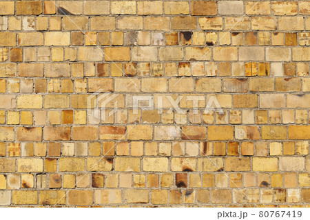 old brick wall of a part of the building 80767419