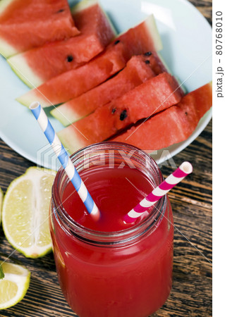 watermelon juice from watermelons and pieces of lime or lemo 80768010