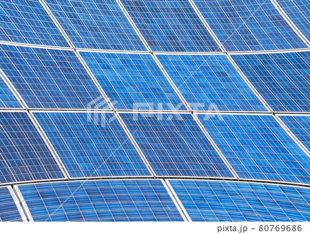 Electric Solar panels with a blue sky reflection. Concept of green energy Electric Solar panels with a blue sky reflection. Concept of green energy 80769686
