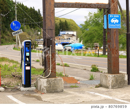 Electric vehicle charging station on service at lake inawashiro. Electric vehicle charging station on service at lake inawashiro. 80769859
