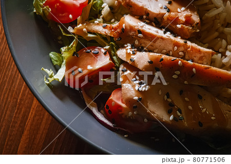 Curry chicken bewast with vegetables and sesame seeds on top, extreme closeup shot 80771506