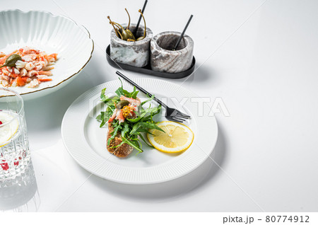 Salad with Crab meat on a kitchen table. White background. Top view. Copy space 80774912