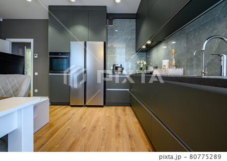 Modern large luxury dark gray kitchen 80775289