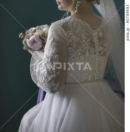 woman with bridal bouquet. eremony wedding day. hands with wedding rings. woman with bridal bouquet. eremony wedding day. hands with wedding rings. 80789683