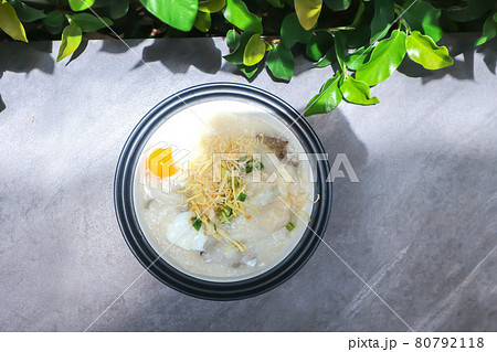 rice gruel or rice porridge or congee with pork , pork ball and egg rice gruel or rice porridge or congee with pork , pork ball and egg 80792118