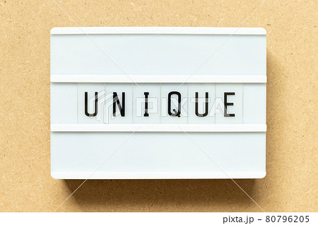 Lightbox with word unique on wood background Lightbox with word unique on wood background 80796205