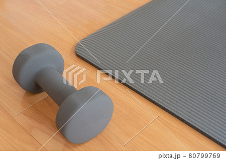 Yoga mat and dumbbells Stock Photo by ©gresey 83547198