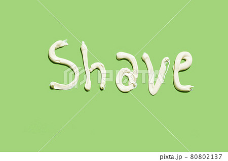 Shave word written with shaving cream on the green background 80802137