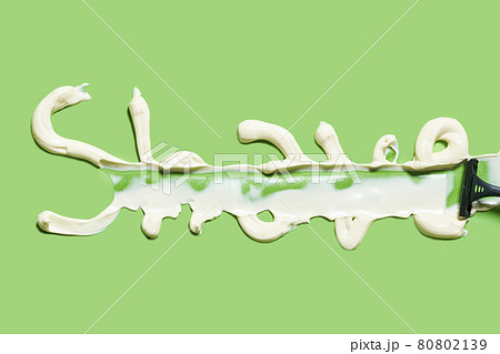 Shave word written with shaving cream on the green background 80802139