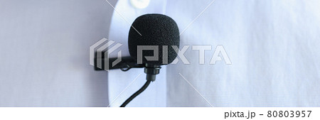Lapel microphone is worn on men blue shirt Lapel microphone is worn on men blue shirt 80803957