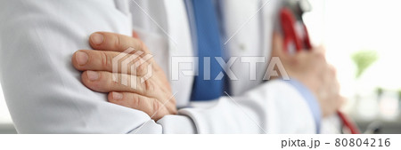 Hands of doctor in white coat holding stethoscope Hands of doctor in white coat holding stethoscope 80804216