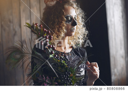 Portrait of smiling woman with Halloween skull make up Portrait of smiling woman with Halloween skull make up 80808866