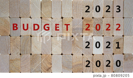 Business concept of budget planning 2022. Wooden cubes with the inscription 'BUDGET 2022' and numbers 2020, 2021, 2023. Beautiful wooden background, copy space. Business, 2022 budget concept. 80809205