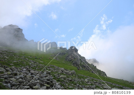 Schwarze Hoerner, mountain peaks in the Pizol region on a misty summer morning. Schwarze Hoerner, mountain peaks in the Pizol region on a misty summer morning. 80810139