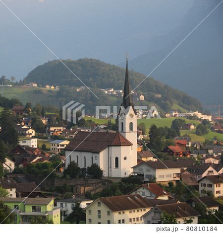 Church and houses in Wangs, St Gallen. Morning scene. 80810184