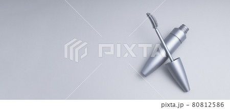 Open tube of carcass. Advertising photography aesthetics and minimalism of cosmetics for eyelashes. Open tube of carcass. Advertising photography aesthetics and minimalism of cosmetics for eyelashes. 80812586