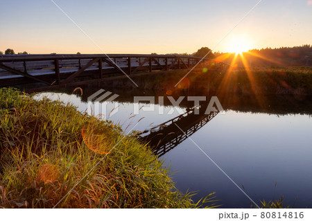 Bridge going over a river in a city park. Bridge going over a river in a city park. 80814816