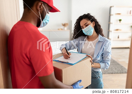 Customer In Medical Face Mask Receiving Order Signing Paper Form 80817214