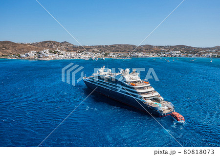 Cruise ship in port. Aerial view of the ship from drone. Blue clear water in the Mediterranean Sea. Cruise ship in port. Aerial view of the ship from drone. Blue clear water in the Mediterranean Sea. 80818073