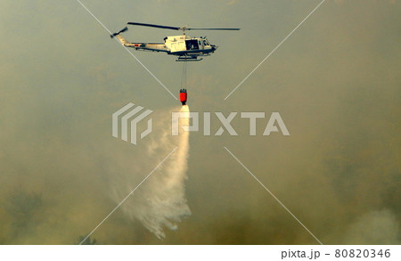 A helicopter extinguishes a fire in the mountains on the border between Israel and Lebanon A helicopter extinguishes a fire in the mountains on the border between Israel and Lebanon 80820346