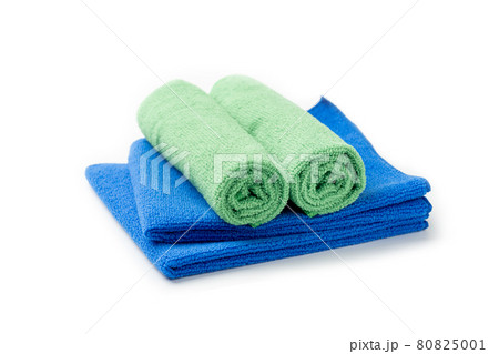 Stack of blue and green towel isolated on white background 80825001