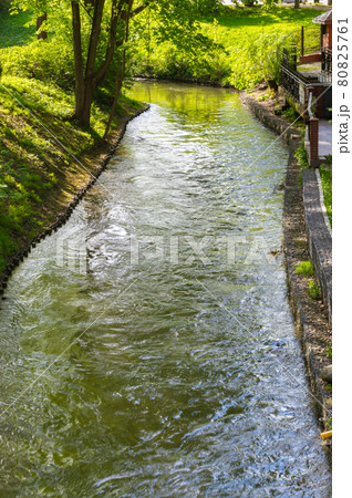 Lyna river in city center of Olsztyn in Poland. Lyna river in city center of Olsztyn in Poland. 80825761