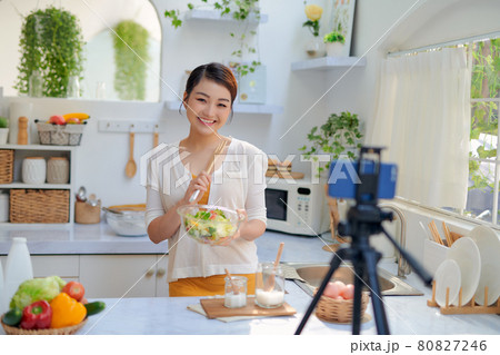 Asian woman recording a video blog Asian woman recording a video blog 80827246