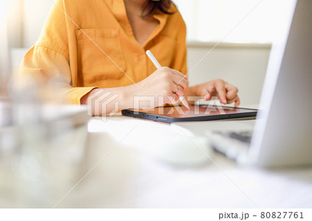 Young female designer artist drawing graphic for new design on tablet at home Art Design Drawing Business and creativity concept 80827761