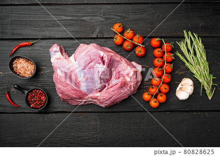 Fresh meat with herbs, oil and spices, on black wooden table background, top view flat lay, with copy space for text Fresh meat with herbs, oil and spices, on black wooden table background, top view flat lay, with copy space for text 80828625