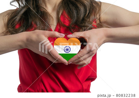 Love India The woman holds a heart in the form of the flag of India on her chest. Concept of patriotism 80832238