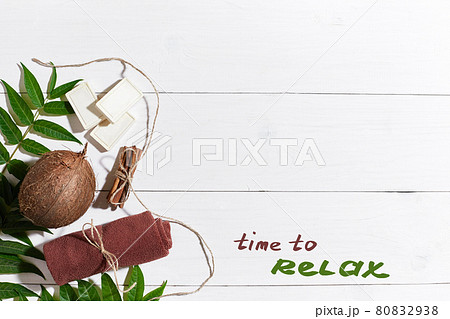 Natural handmade soaps with cinnamon, brown towel, coconut and green leaves on white wooden background Natural handmade soaps with cinnamon, brown towel, coconut and green leaves on white wooden background 80832938
