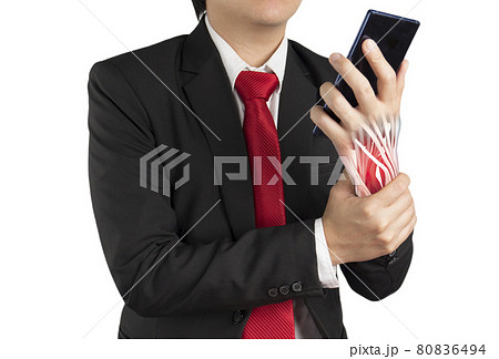 office worker holding mobile phone feels pain his wrist 80836494