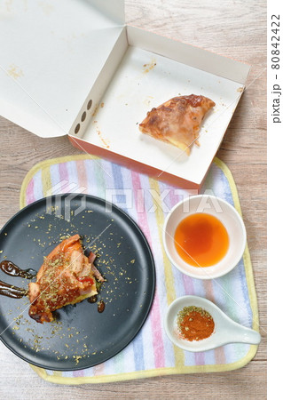 homemade pizza topping pork bacon sausage and cheese dressing mashed dry oregano with kitchup on plate 80842422