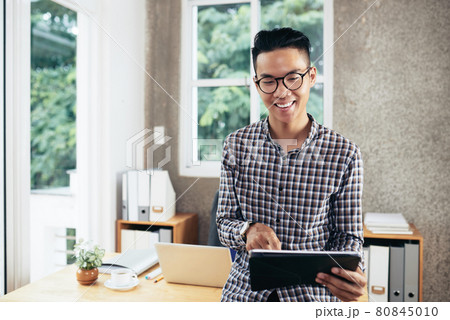 Entrepreneur Working on Tablet Computer 80845010