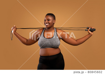 Young Black Chubby Woman Posing With Jumping Rope At Studio Young Black Chubby Woman Posing With Jumping Rope At Studio 80845602