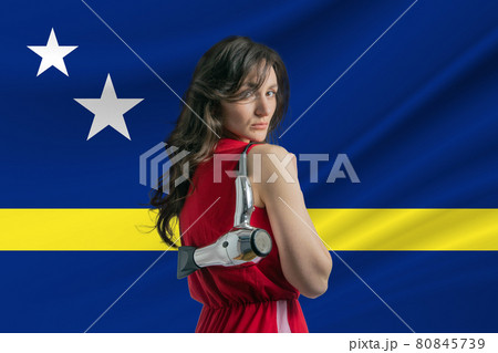 Beauty industry in Curacao. Happy female hairdresser holding hairdryer against Curacao flag background 80845739