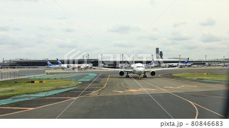 Narita International Airport view, Airplane taxi in taxiway prepare to take-off. Narita International Airport view, Airplane taxi in taxiway prepare to take-off. 80846683