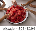 Children hold pieces of watermelon. Selective focus. Top view 80848194